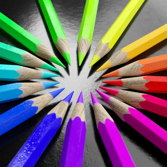 Colored pencils arranged in a circle according to color gradient
